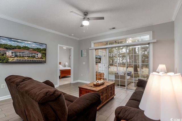 living room with crown molding, ceiling fan, and light hardwood / wood-style flooring