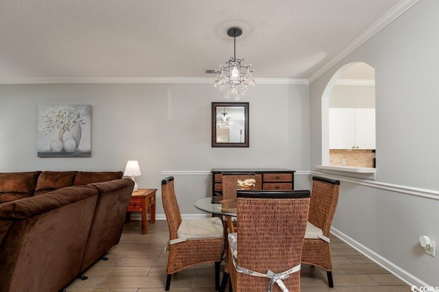 dining space with crown molding