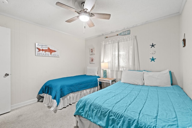 bedroom with light carpet, crown molding, ceiling fan, and a textured ceiling