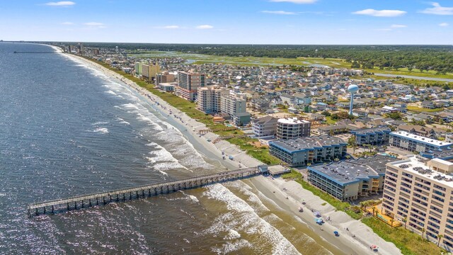 aerial view featuring a view of the beach and a water view