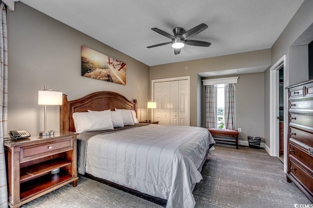 carpeted bedroom featuring ceiling fan, a textured ceiling, baseboards, and a closet