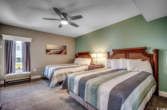 carpeted bedroom with a ceiling fan, baseboards, and a textured ceiling