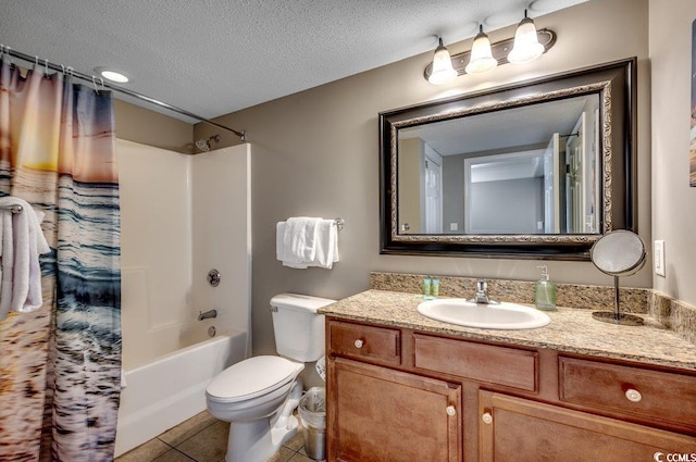 bathroom featuring toilet, shower / bath combo, a textured ceiling, vanity, and tile patterned flooring