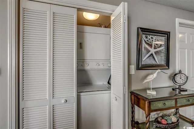 laundry area with laundry area and stacked washing maching and dryer