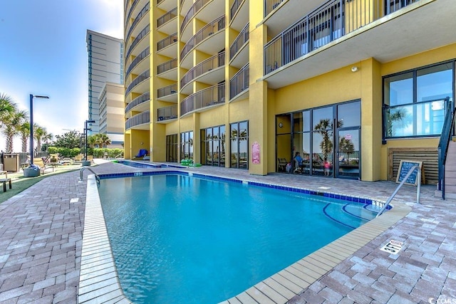 pool with a patio area