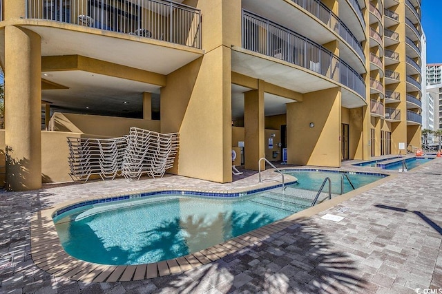 pool featuring a patio area