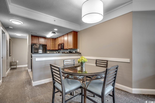 dining space with crown molding, baseboards, and a textured ceiling