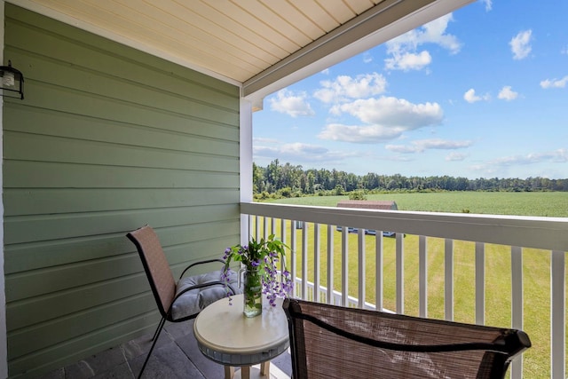 balcony featuring a rural view