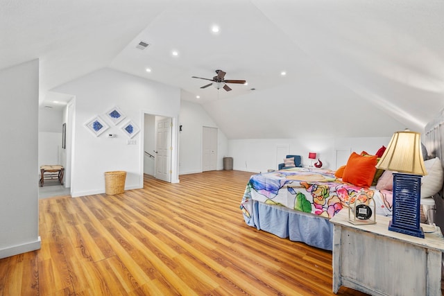 bedroom featuring lofted ceiling, hardwood / wood-style flooring, and ceiling fan