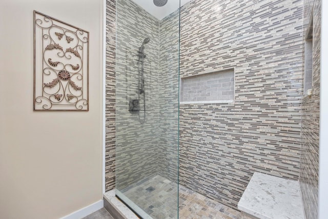 bathroom with tiled shower