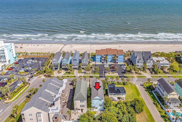 bird's eye view with a water view and a view of the beach