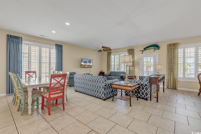 tiled living room featuring ceiling fan