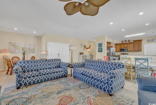 living room with ceiling fan and light tile patterned floors