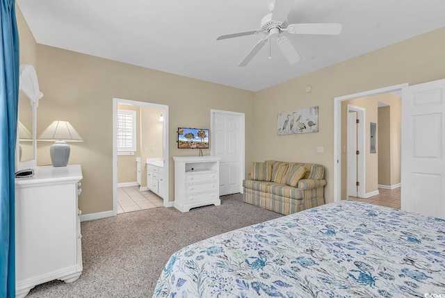 carpeted bedroom with ceiling fan and connected bathroom