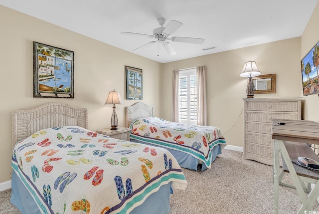 bedroom with ceiling fan and light colored carpet