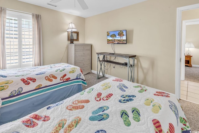 carpeted bedroom with ceiling fan