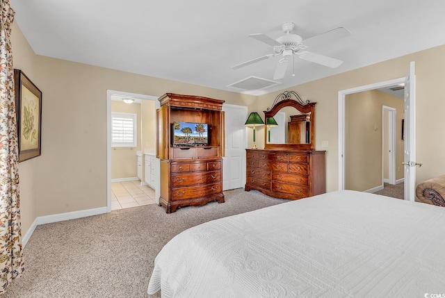 carpeted bedroom featuring ensuite bathroom and ceiling fan