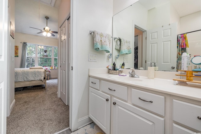 bathroom with ceiling fan and vanity