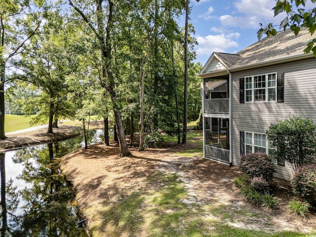 view of yard with a sunroom