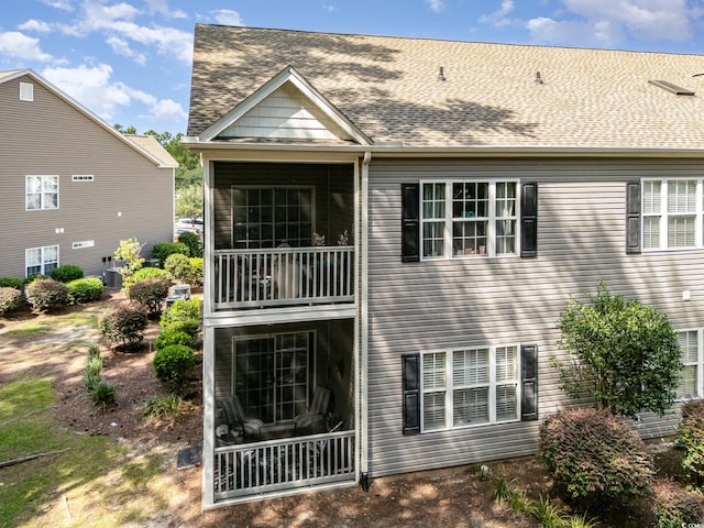 back of house with a balcony