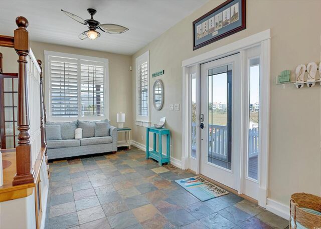 entrance foyer with a healthy amount of sunlight and ceiling fan