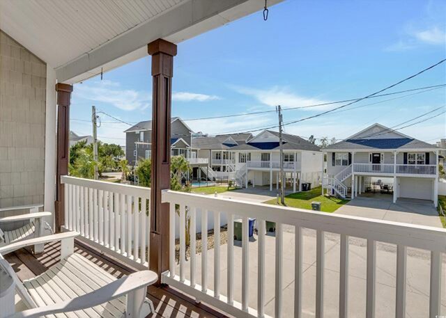 view of pool featuring a patio area, a wooden deck, and a hot tub