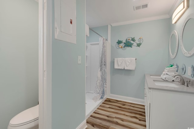 bathroom with vanity, toilet, electric panel, curtained shower, and hardwood / wood-style floors