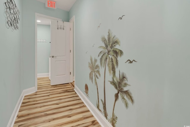 corridor with light hardwood / wood-style floors