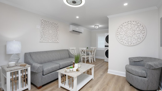 living room with light hardwood / wood-style flooring, crown molding, stacked washer / drying machine, and an AC wall unit