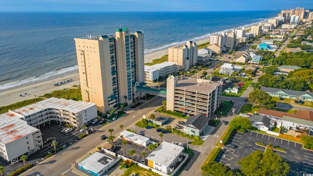 birds eye view of property featuring a view of the beach and a water view