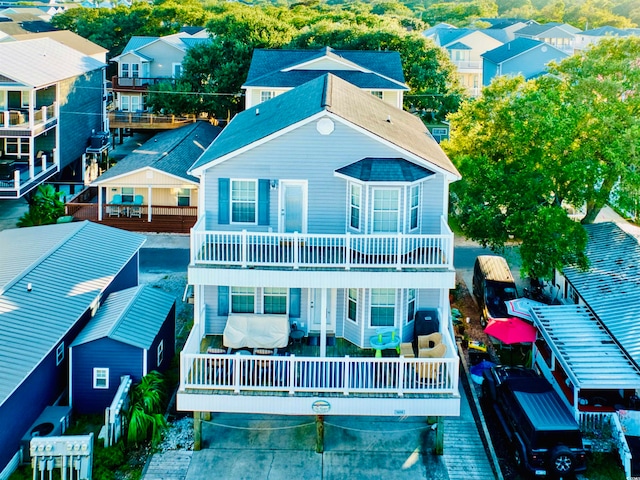 rear view of property with a balcony