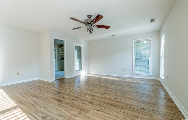 spare room featuring ceiling fan and light wood-type flooring