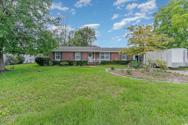 ranch-style home with a front lawn