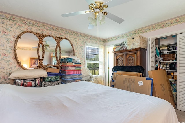 bedroom featuring ceiling fan and a closet