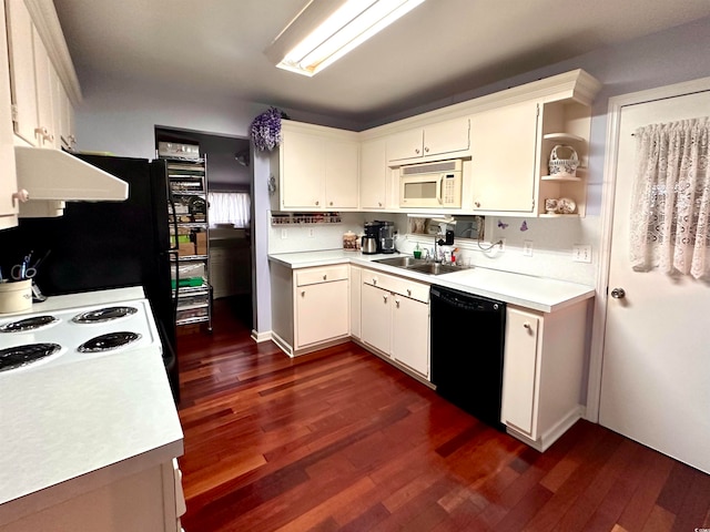 kitchen featuring dark wood-type flooring, exhaust hood, sink, and black dishwasher