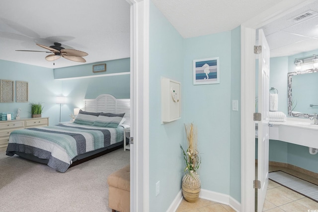 bedroom with ceiling fan and light colored carpet