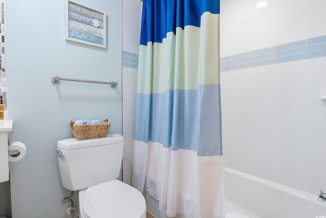 bathroom with toilet and shower / tub combo