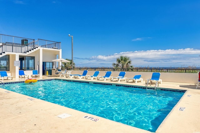 view of swimming pool with a patio area