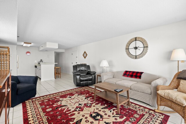 tiled living room with a textured ceiling