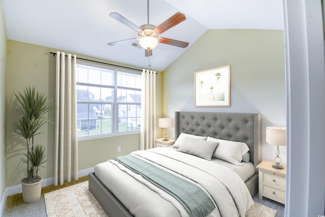 carpeted bedroom with ceiling fan and vaulted ceiling