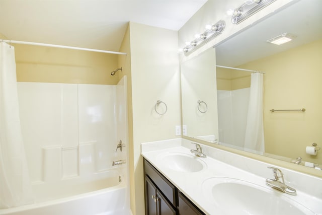 bathroom with vanity and shower / bath combo