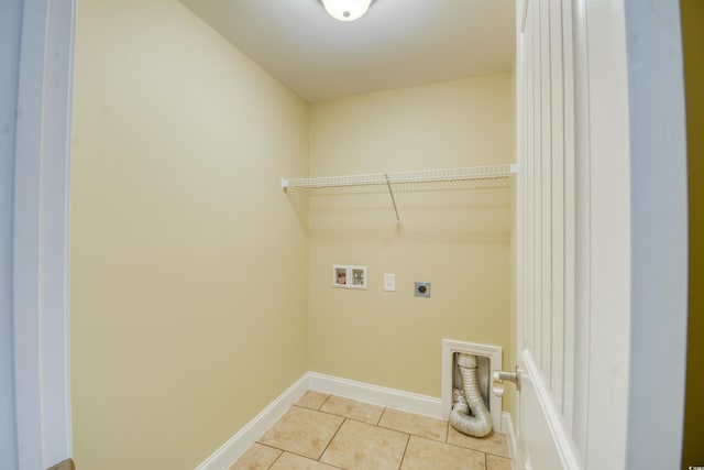 laundry room featuring washer hookup, light tile patterned floors, and electric dryer hookup