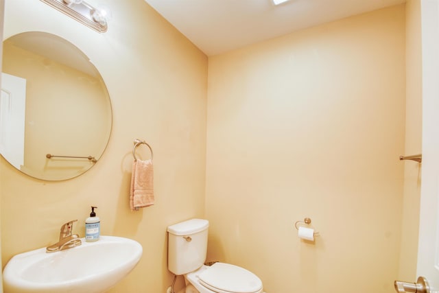 bathroom with toilet and sink