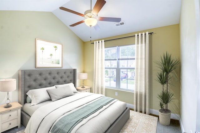 bedroom featuring lofted ceiling, ceiling fan, and carpet floors