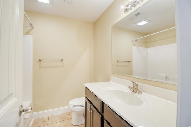 full bathroom featuring vanity, toilet, tile patterned floors, and bathing tub / shower combination