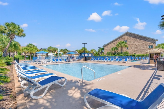 view of swimming pool with a patio