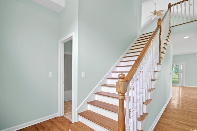 stairs with hardwood / wood-style floors