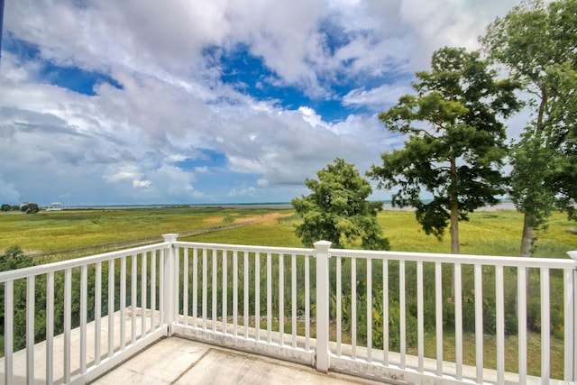 balcony featuring a rural view