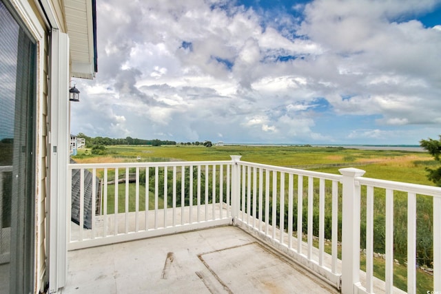 balcony featuring a rural view