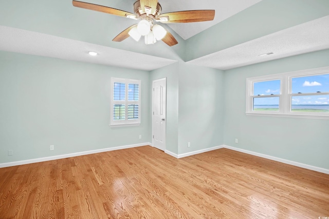 unfurnished room featuring light wood-type flooring, a textured ceiling, and ceiling fan